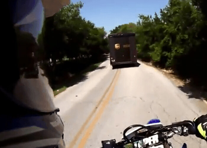 VIDEO: Stupid Motorcyclist Hits UPS Truck