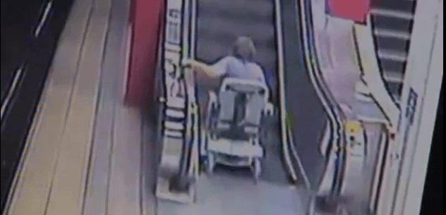Woman Attempts To Ride Scooter Up an Escalator