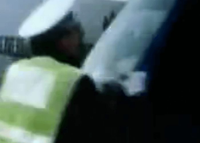 VIDEO: Police Officer Holds Onto Runaway Truck