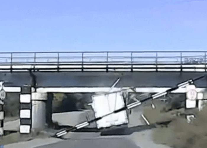 VIDEO: Truck Driver Tries To Pass Under Low Bridge