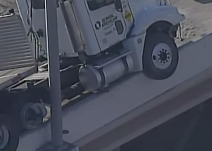 VIDEO: Driver Blows Tire, Dangles Over Overpass