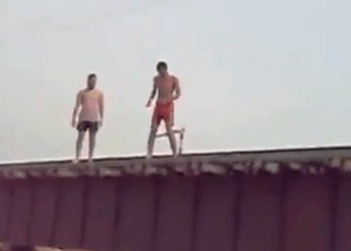 VIDEO: Insane Guys Jump Off Train Bridge