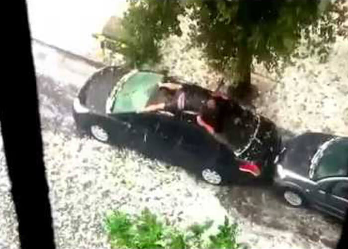 VIDEO: Man Tries To Protect His Car From Hail