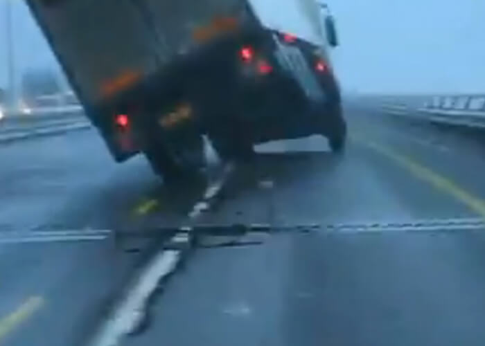 Video: Wind Tips Over Truck On Bridge