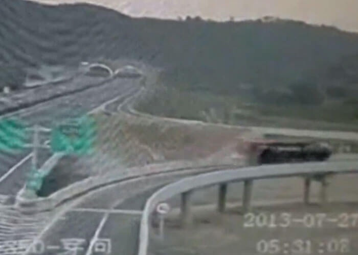 VIDEO: Container Falls Off Truck And Over Bridge