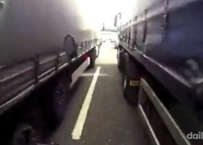 VIDEO: Motorcyclist Becomes Part Of Truck Sandwich