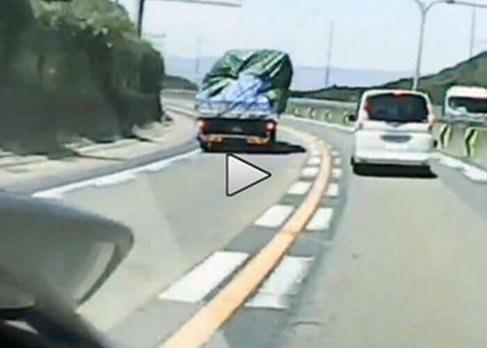 VIDEO: Shifting Load Topples Truck