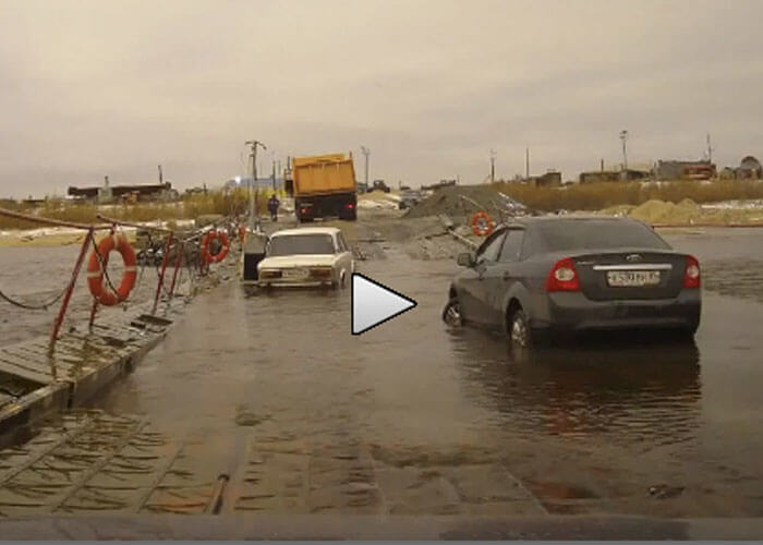 VIDEO: Dirt Bag Dump Truck Driver Floods Cars Crossing Bridge