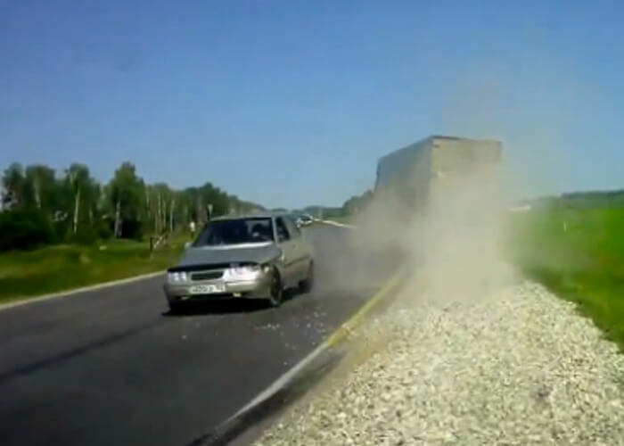 VIDEO: Driver Just Misses Death After Close Call With Semi Truck