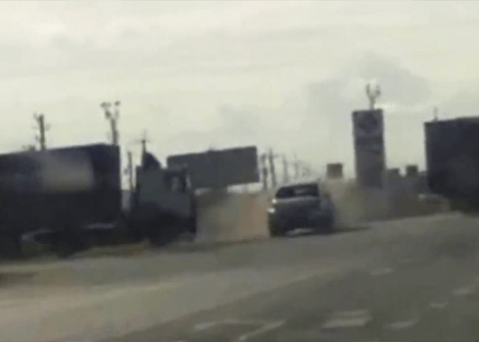 VIDEO: Car Hits Tow Rope Between Trucks