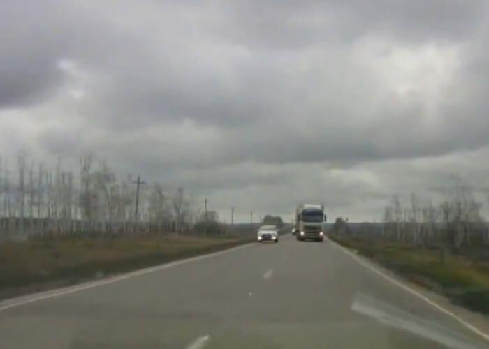 VIDEO: Near Miss With Overtaking Truck