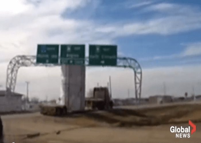 VIDEO: Truck Takes Out Sign, Two Power Poles