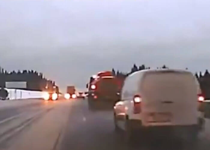 VIDEO: Overtaking Car Narrowly Avoids Head-On With Truck