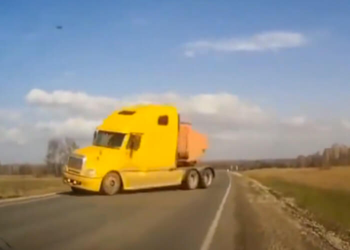 VIDEO: Driver Narrowly Avoids Oncoming Truck