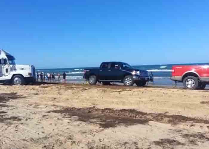 VIDEO: Pickups Pull Truck Out Of Sand