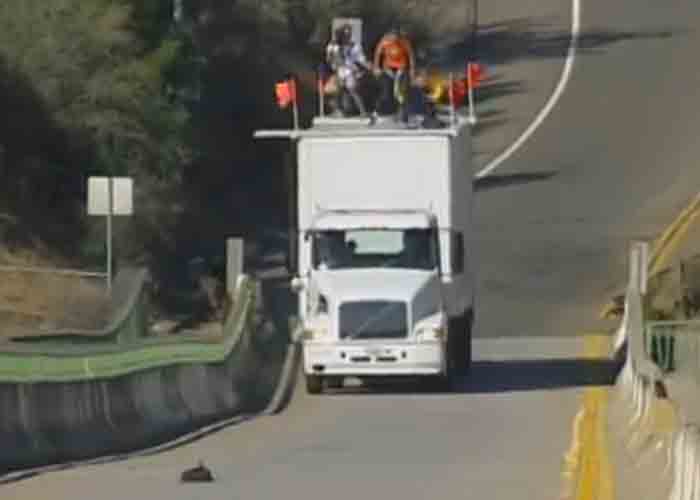 Video: INSANE! Base Jumping off a Moving Truck