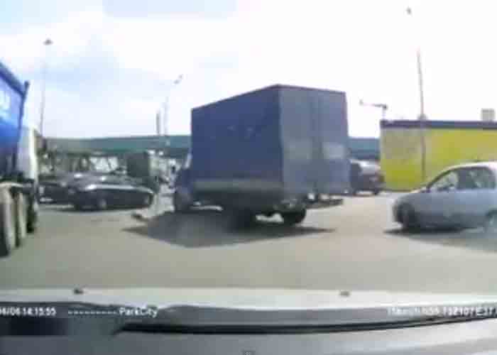 Video: Driver Tries to Squeeze By Truck and Fails