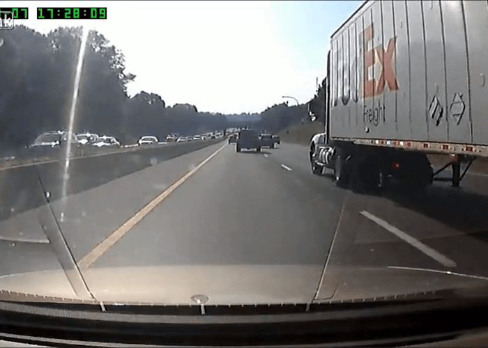 Video: Distracted Driver Nearly Sideswipes Truck