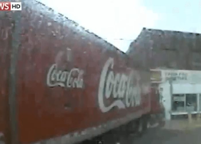 Video: Coca-Cola Truck Sideswipes Bus, Hits Building