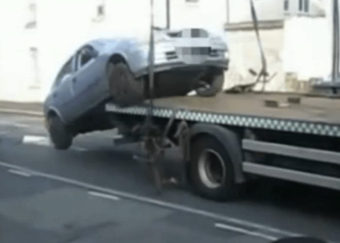 VIDEO: Angry Driver Backs Off Of Tow Truck