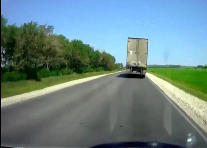 Video: Passing Car Runs Truck Off The Road