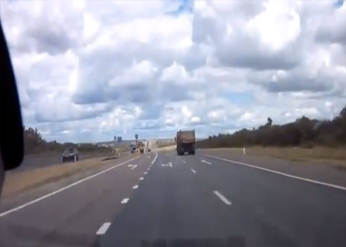 Video: Car Hits Turning Truck