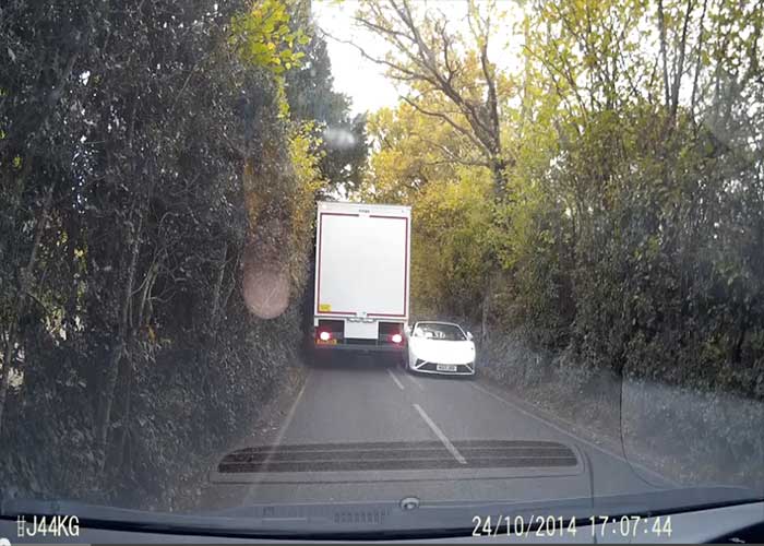 Video: White Lamborghini Gallardo Unsuccessfully Squeezes By Truck