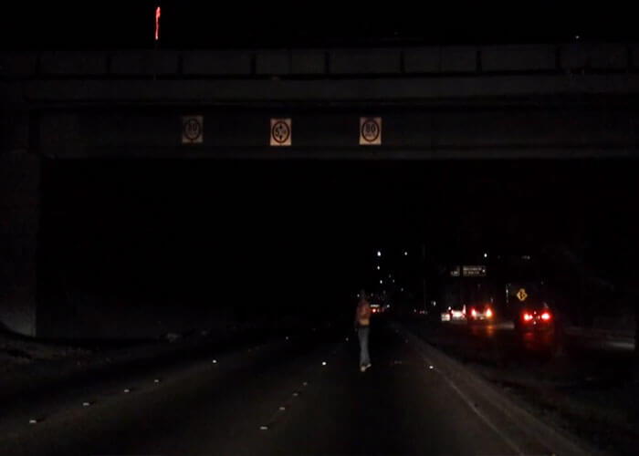 Video: Guy Jumps Off Overpass, Lands Hard and Walks Away