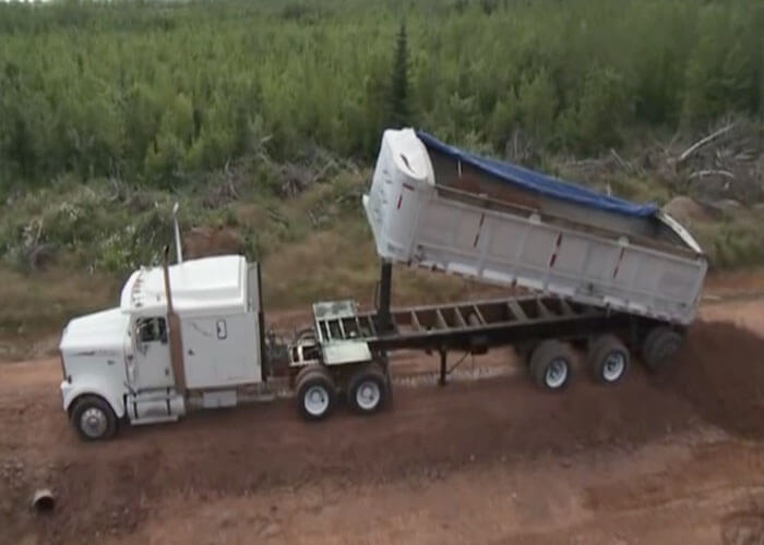 Video: Dump Truck Rolls Over