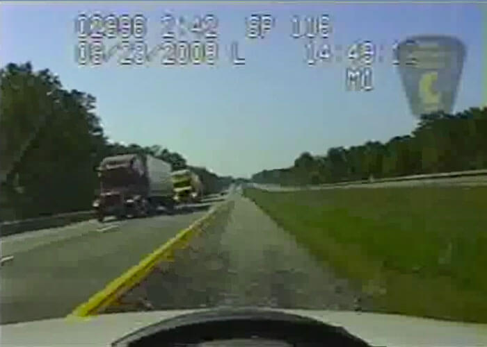 Video: Truck Nearly Hits Police Cruiser Head-On