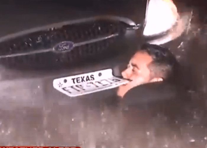 VIDEO: Tow Truck Driver Dives Under Flood Waters To Rescue Stalled Car