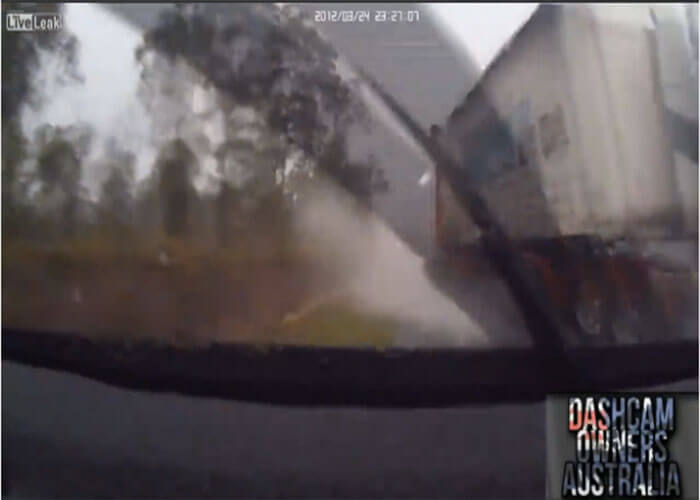 VIDEO: Truck Jackknifes On Wet Roads and Hits a Car