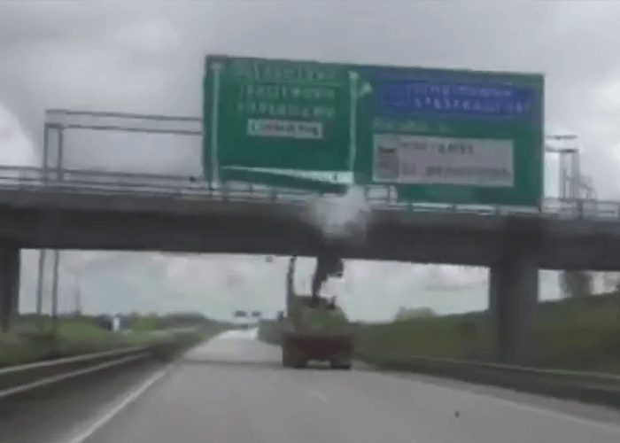 VIDEO: Truck Strikes Sign And Bridge