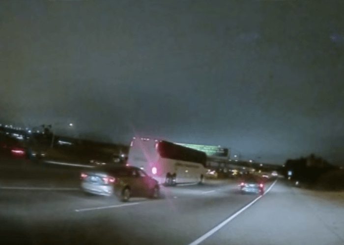 VIDEO: Tour Bus Backs Up On Freeway
