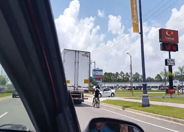 VIDEO: Bicyclist Hitches A Ride