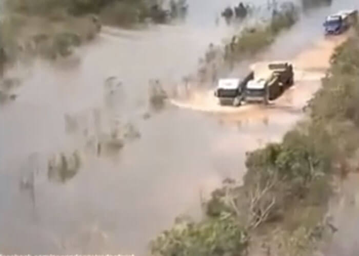 VIDEO: Trio Of Trucks Drive Through Flood