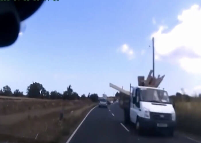 VIDEO: Wood Flies Off Truck And Crashes Through Oncoming Car’s Windshield