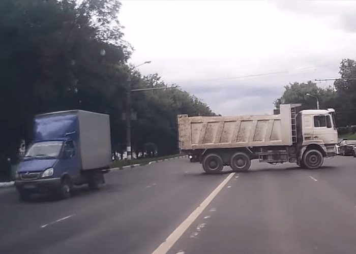 VIDEO: Dump Truck Rolls Backwards Into Busy Street