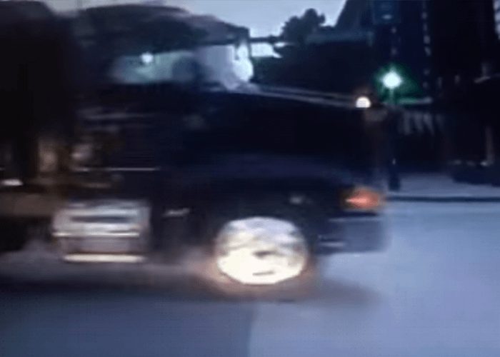 VIDEO: Truck Runs Red Light In Front Of Cop