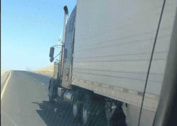 VIDEO: Aggressive Truck Driver Runs Car Off Road
