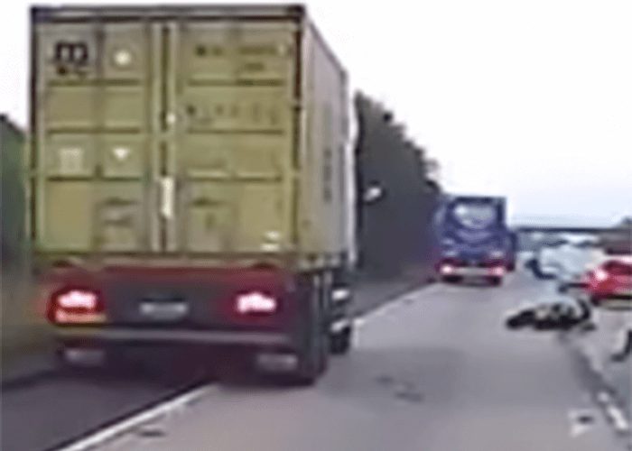 VIDEO: Truck Driver Avoids Crushing Crashed Motorcyclist