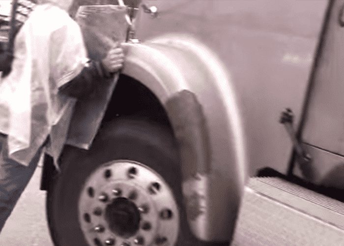 VIDEO: Activists Cling To Moving Truck