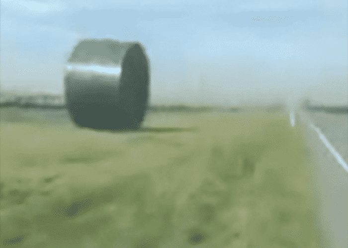 VIDEO: Plastic Water Tank Bounces Down Highway