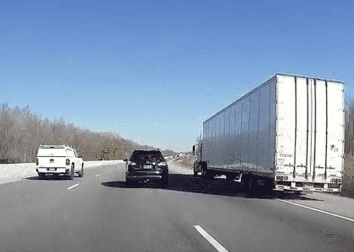 VIDEO: Highway Hogging Nissan Forces Truck Off Road