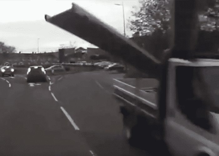 VIDEO: Truck Driver Cheats Death As Metal Platform Crashes Though Windshield