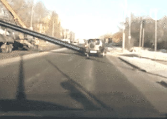 VIDEO: Pipe Falls Off Truck And Smashes Into SUV