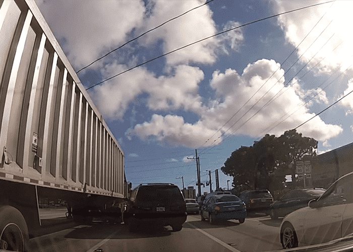 VIDEO: Suburban Driver Pays The Price For Trying To Force In Front Of Truck