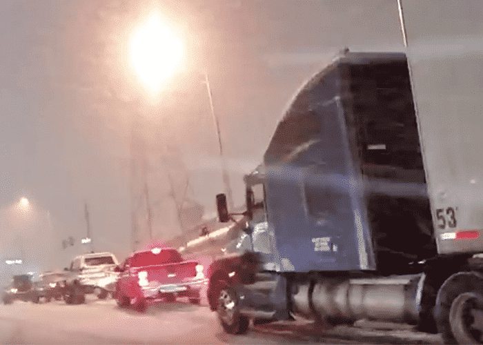 VIDEO: Four Colorado Motorists Team Up To Help Stuck Trucker