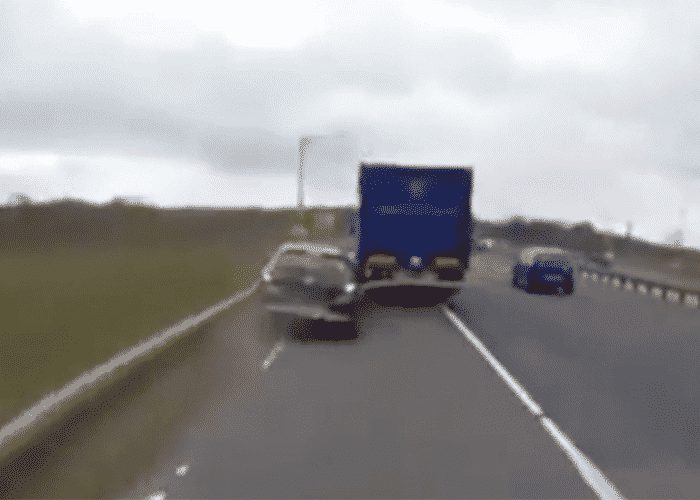 VIDEO: Truck Crunches Car And Drives Away