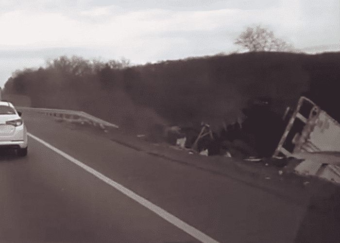 VIDEO: Truck Grinds Guardrail, Breaks Though, Flips